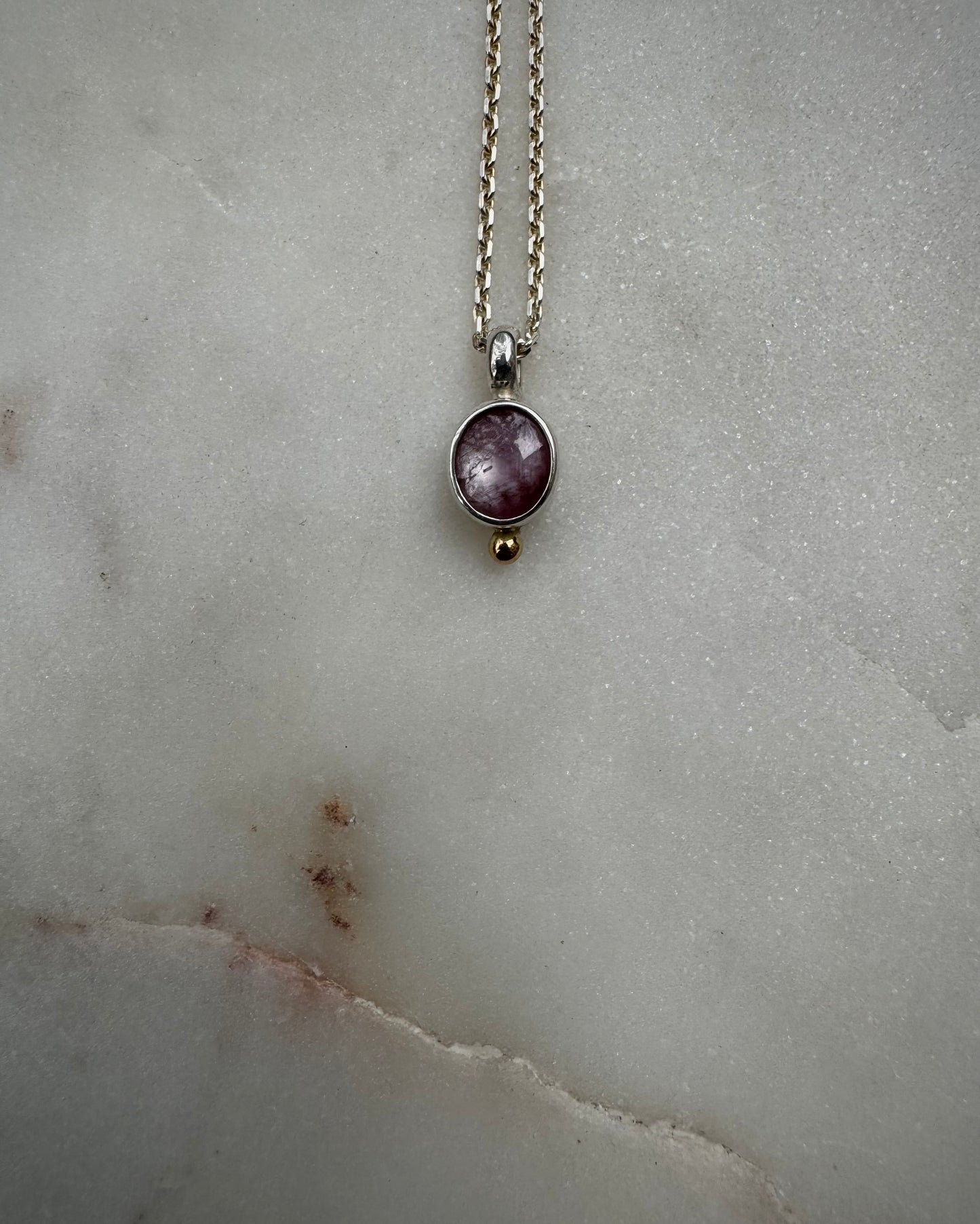 Small amulets with 18k gold