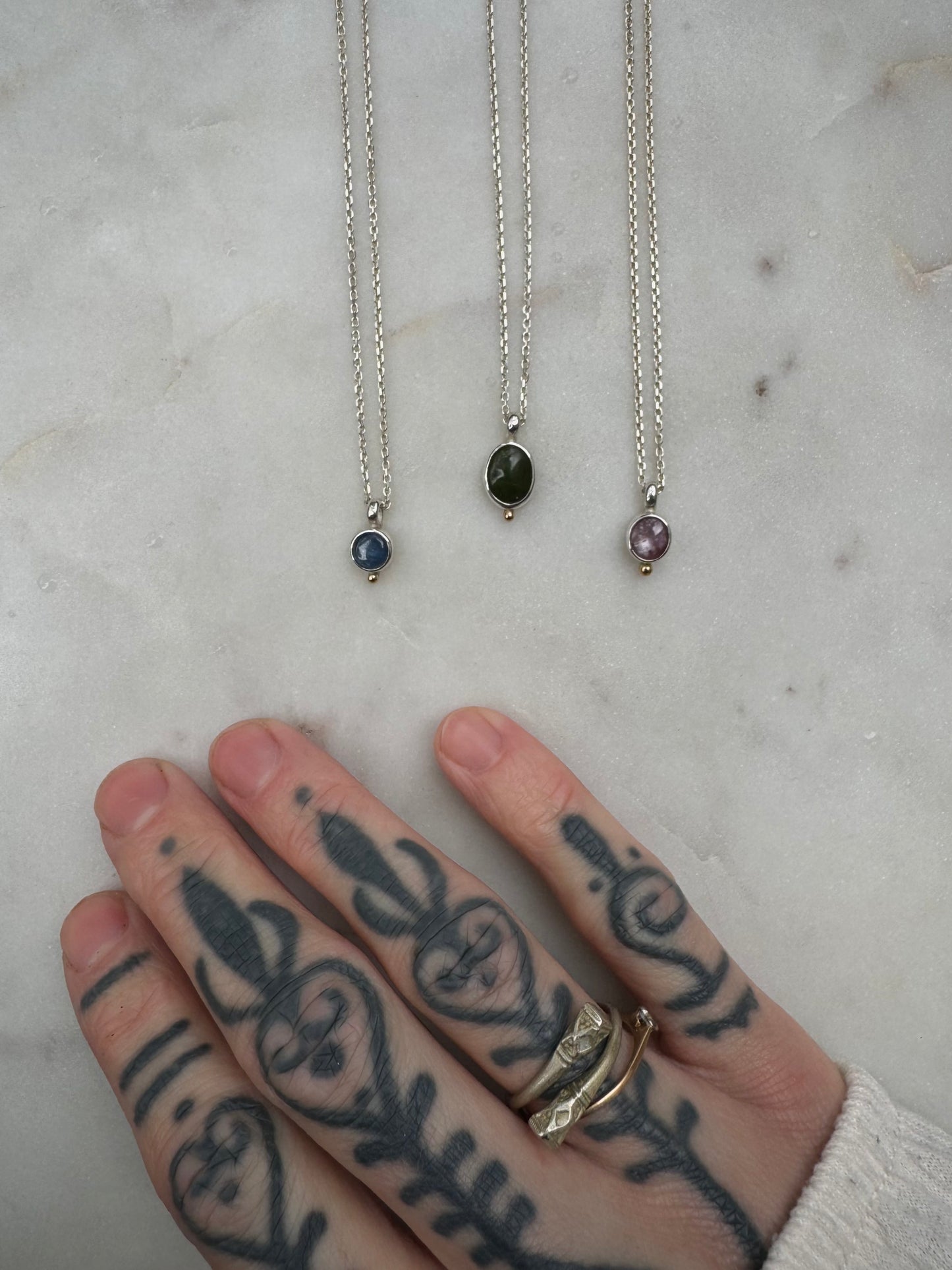 Small amulets with 18k gold