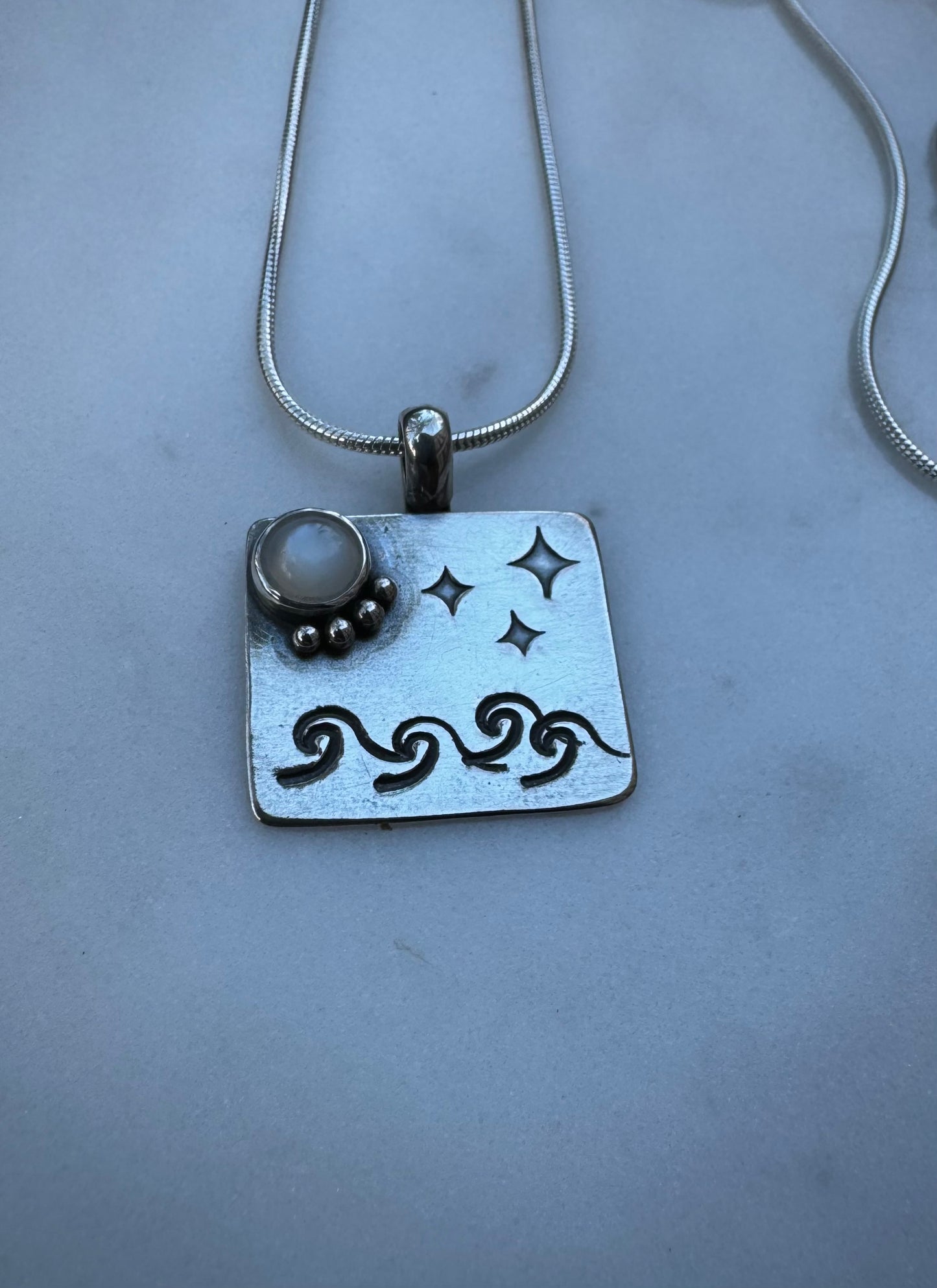 Moonlight sea amulet