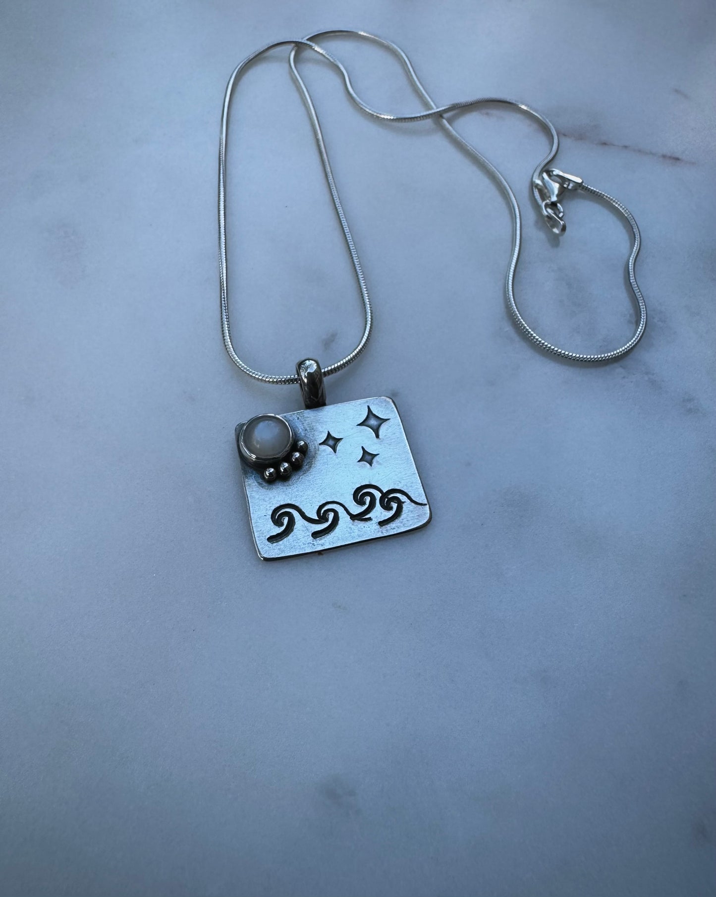 Moonlight sea amulet