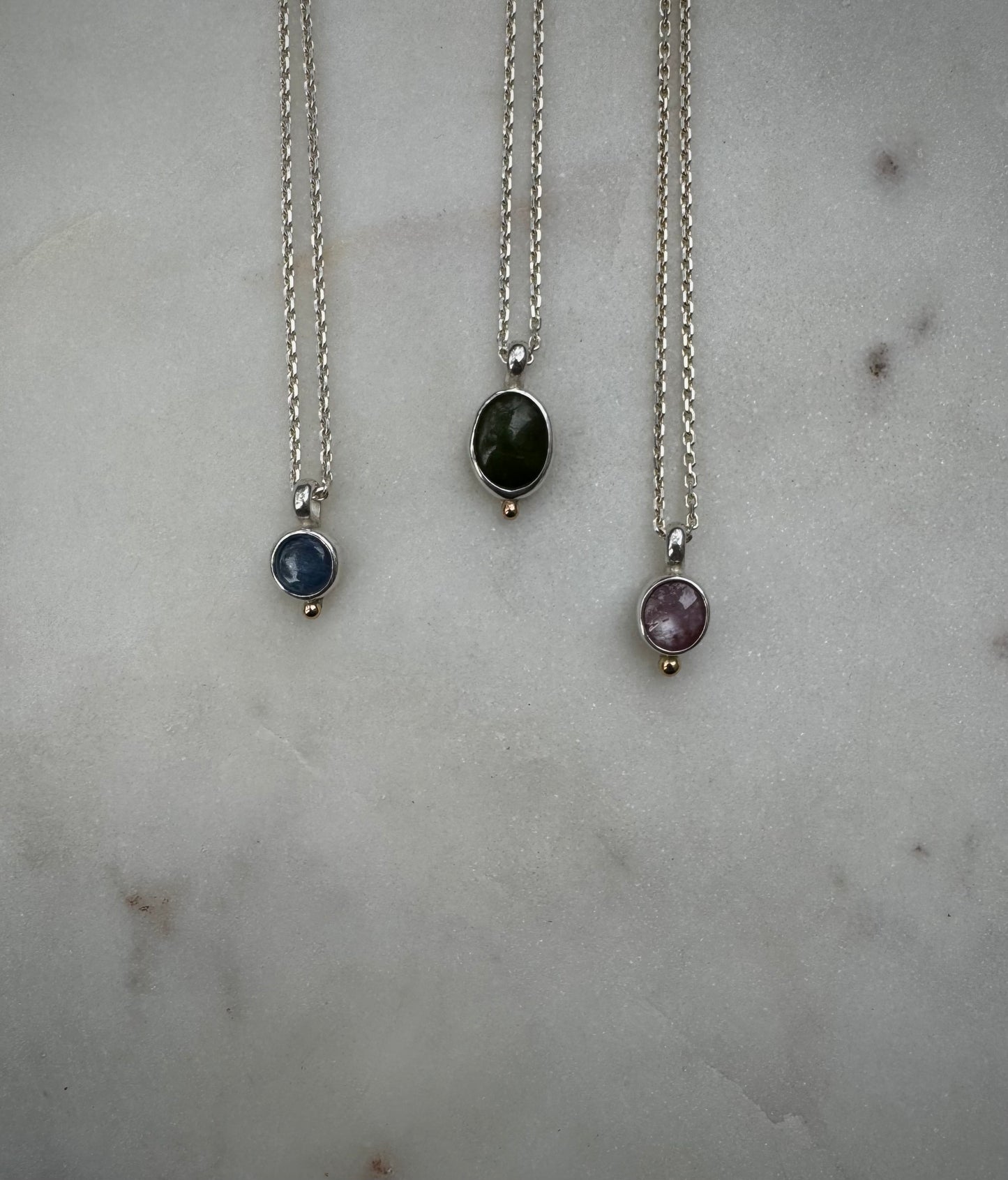 Small amulets with 18k gold