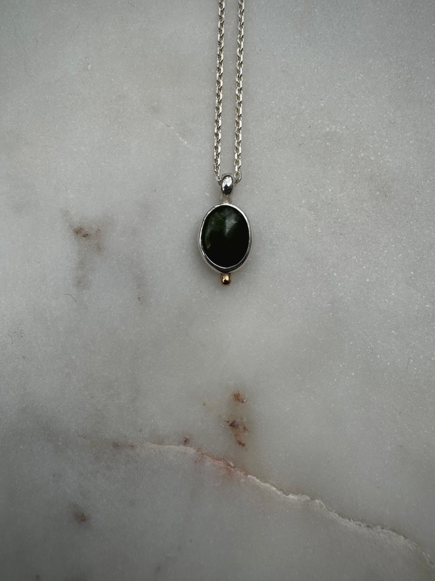 Small amulets with 18k gold