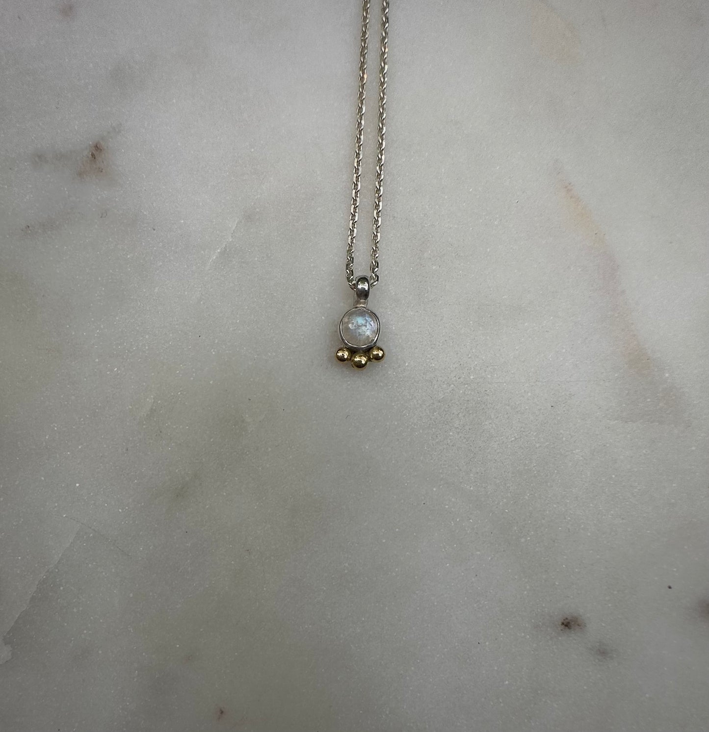 Mini rainbow moonstone amulet with 18k gold dots