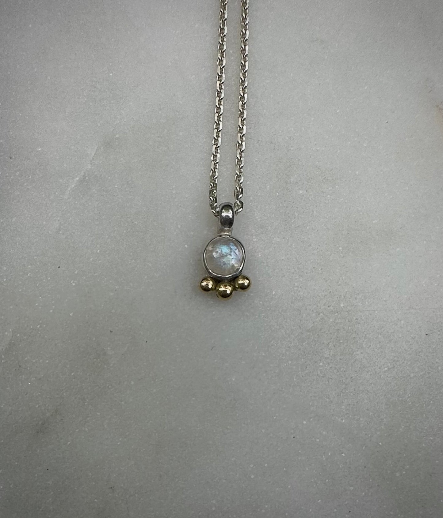 Mini rainbow moonstone amulet with 18k gold dots