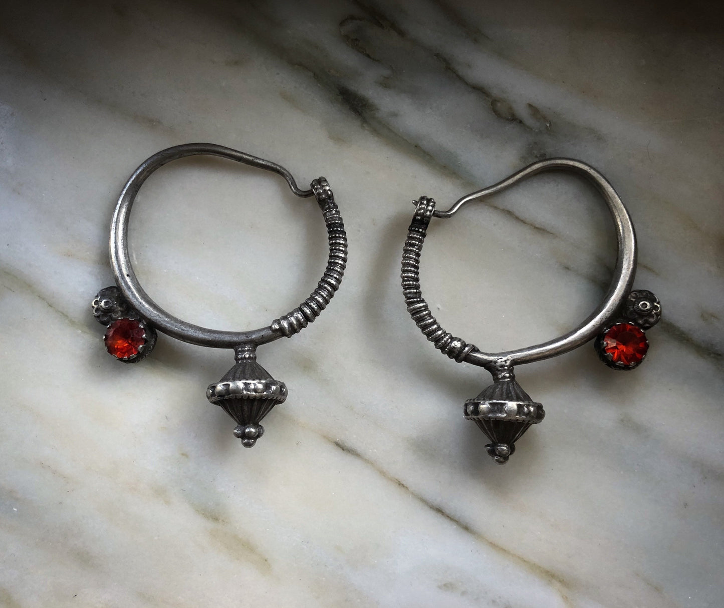 Antique poppy seed ear weights from northen Pakistan