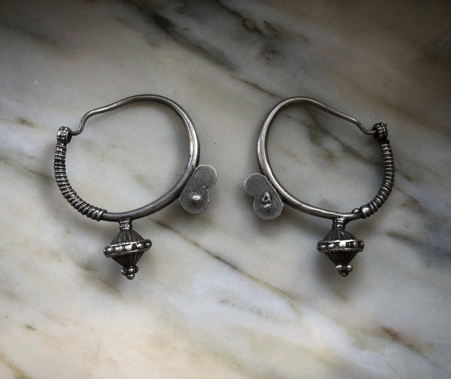 Antique poppy seed ear weights from northen Pakistan