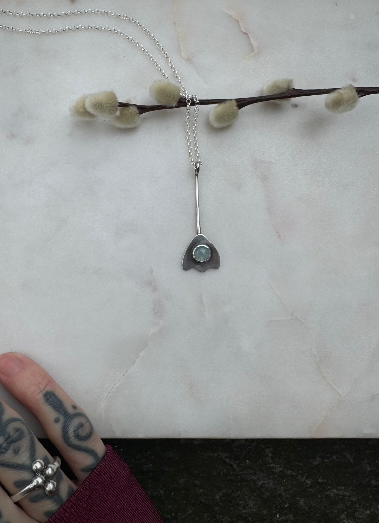 Aquamarine flower amulet