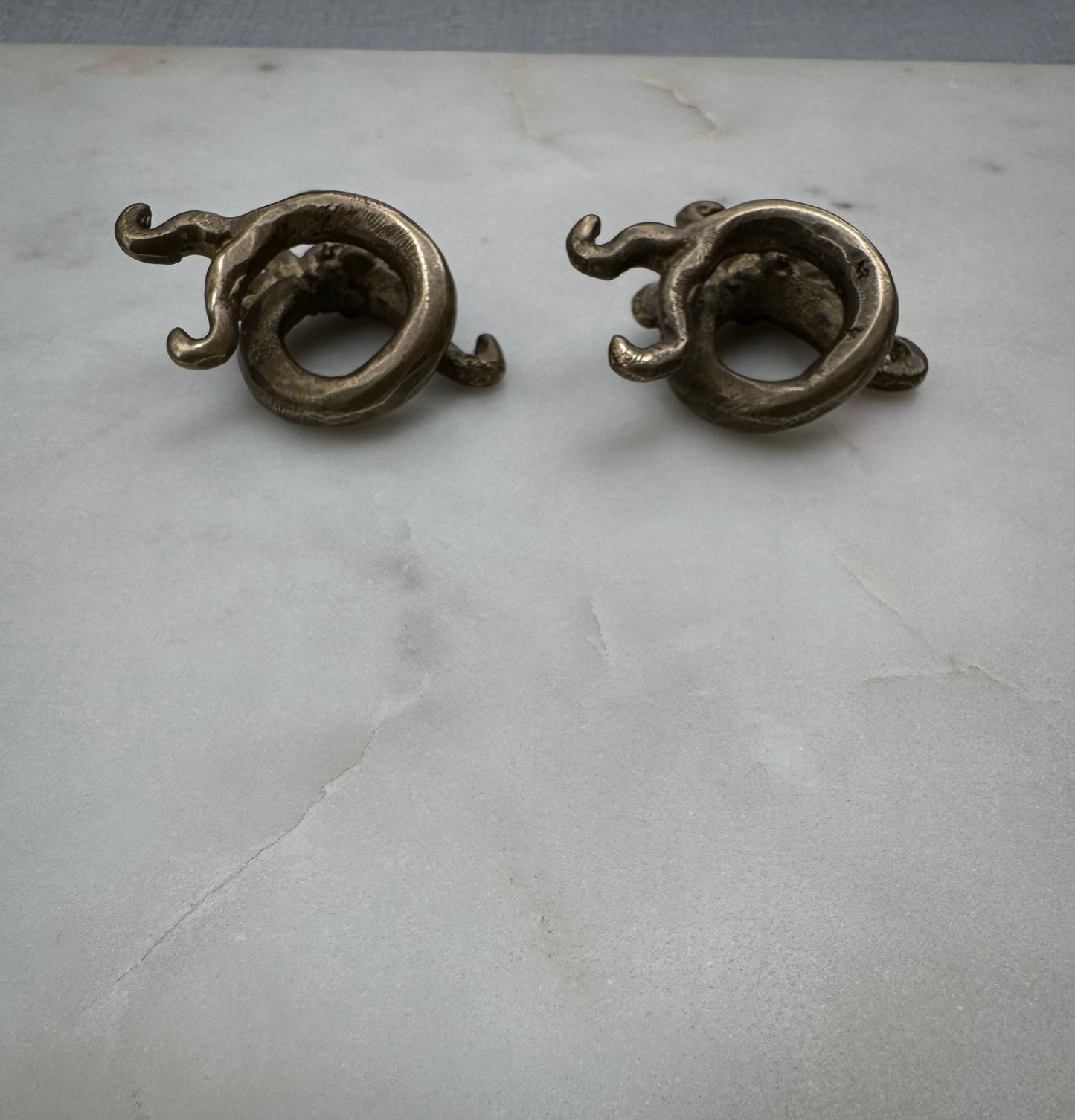 Dragon brass war weights from Borneo