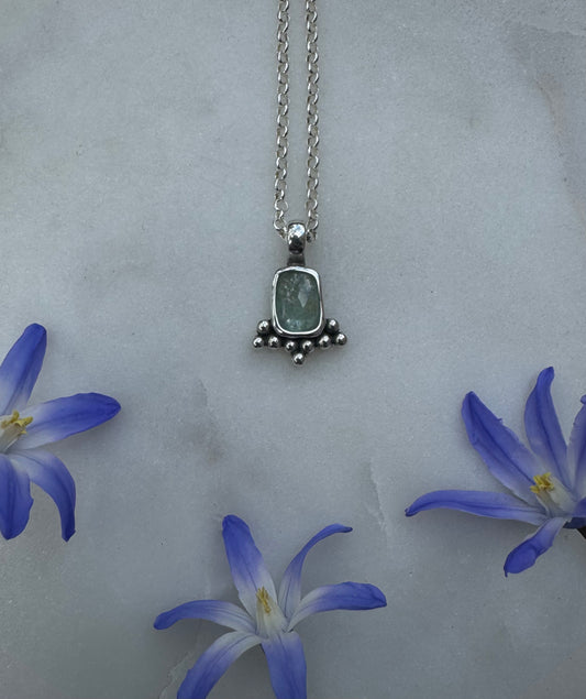 Small silver amulet with aquamarine