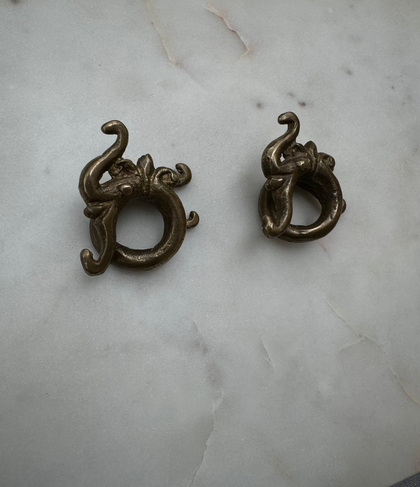 Dragon brass war weights from Borneo