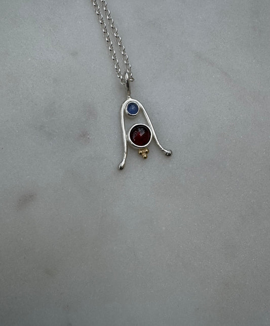 Amulet with Tanzanite, Garnet and 18k gold