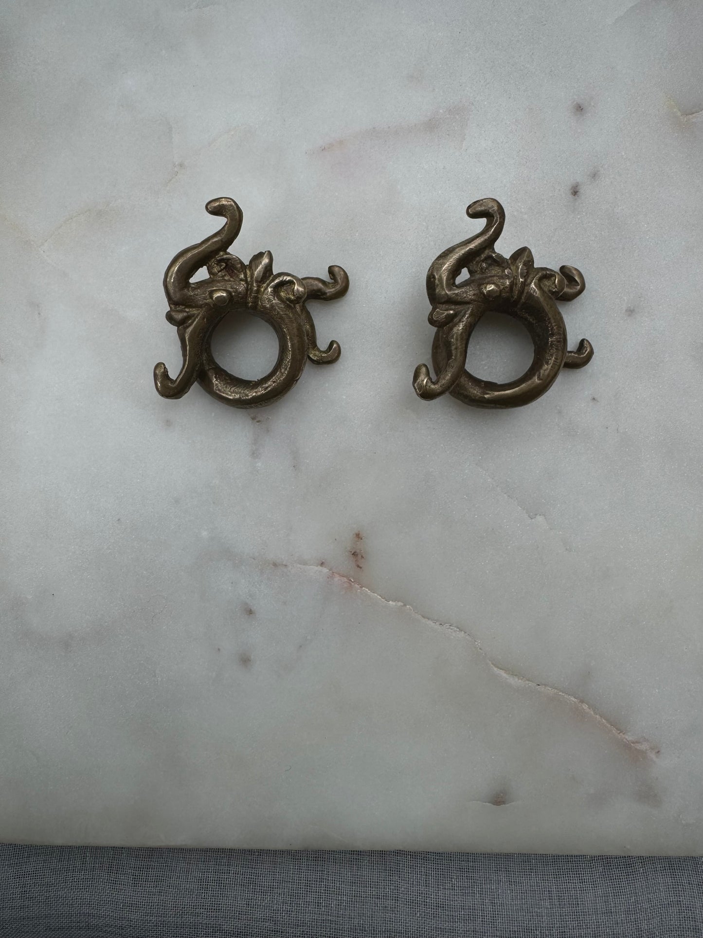Dragon brass war weights from Borneo