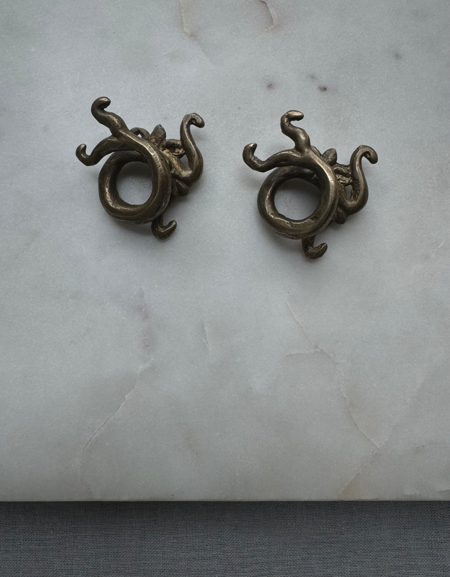 Dragon brass war weights from Borneo