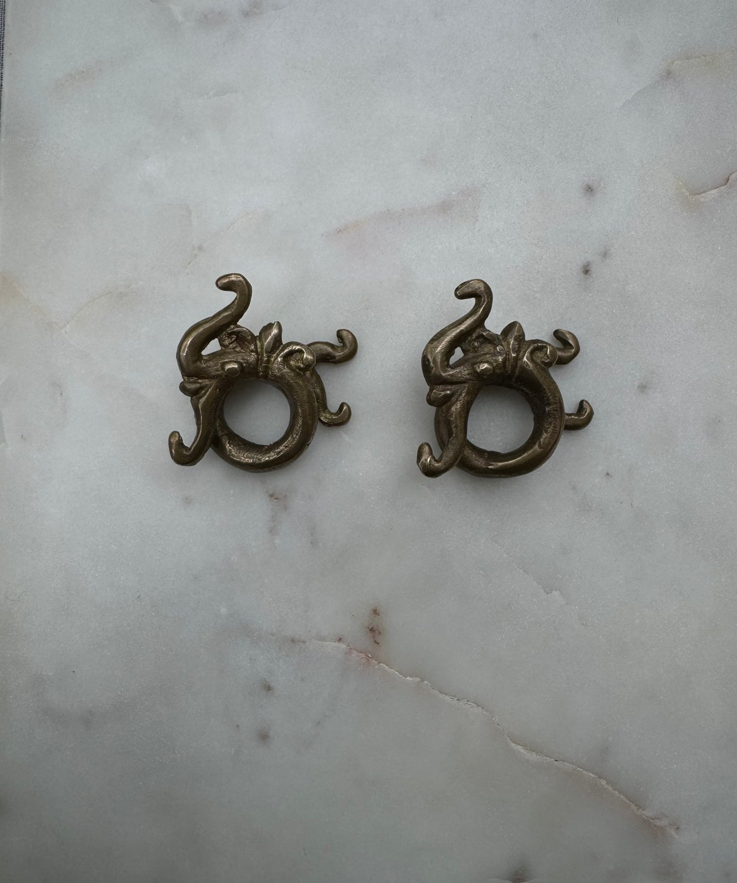 Dragon brass war weights from Borneo