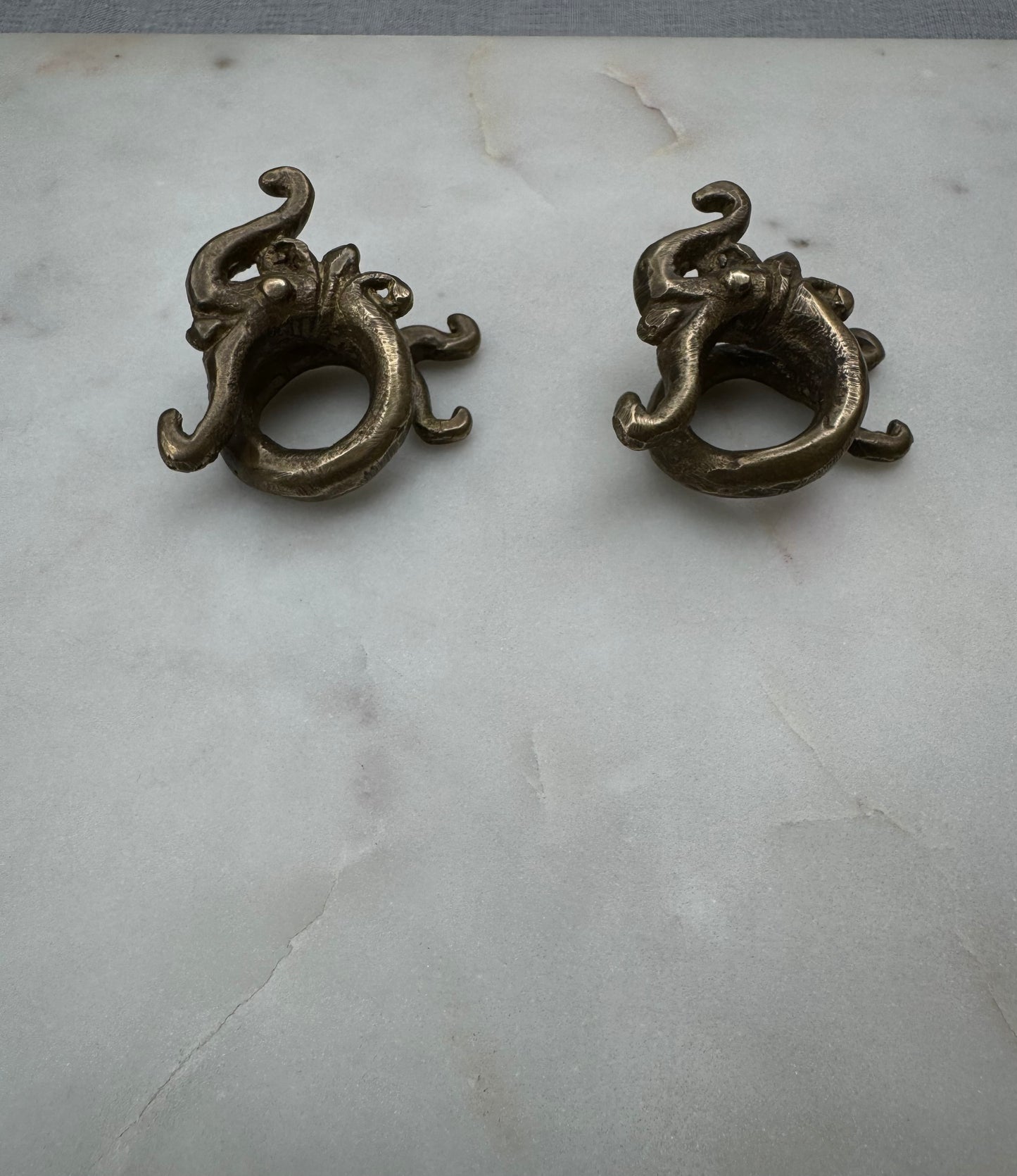 Dragon brass war weights from Borneo