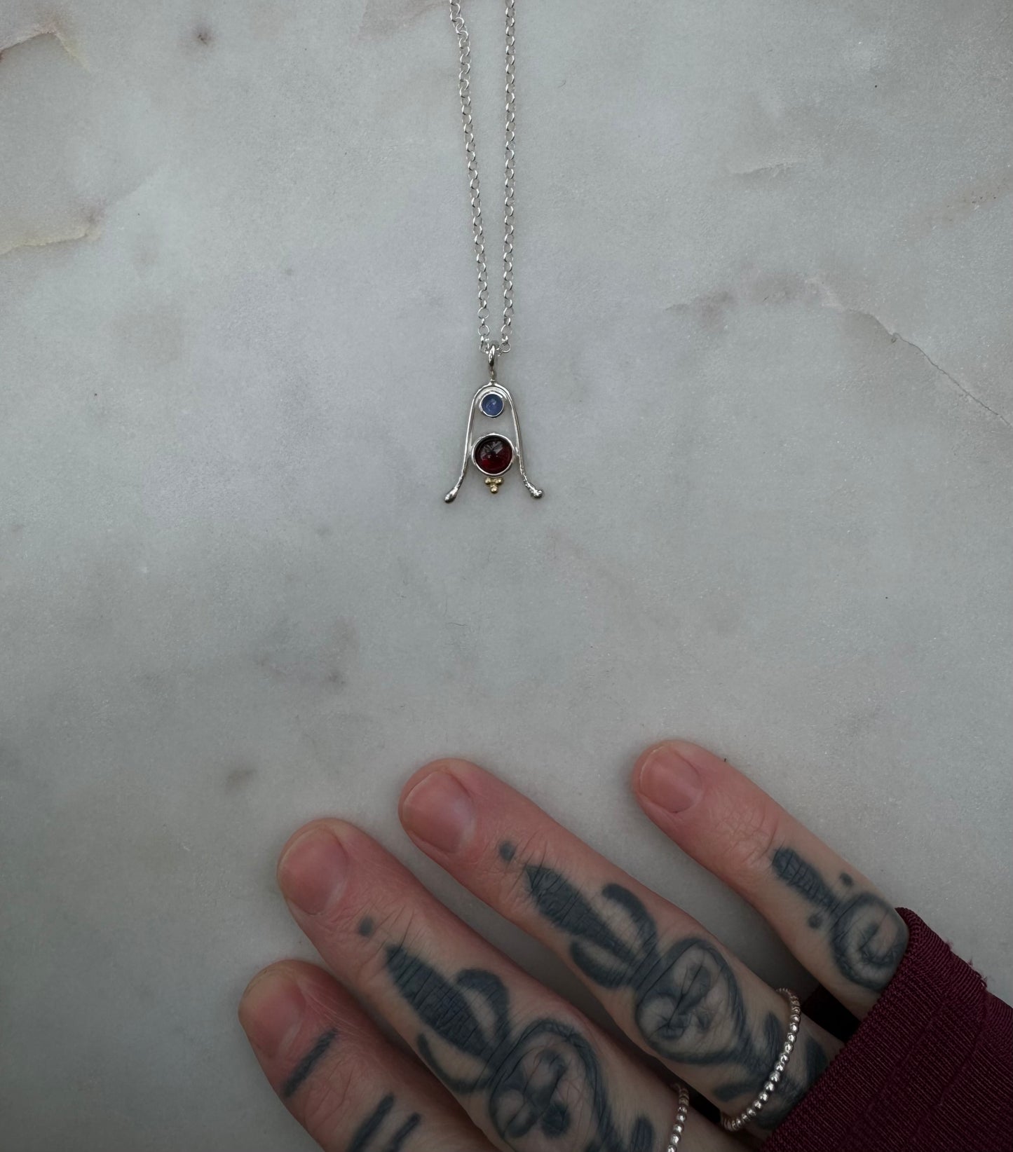 Amulet with Tanzanite, Garnet and 18k gold