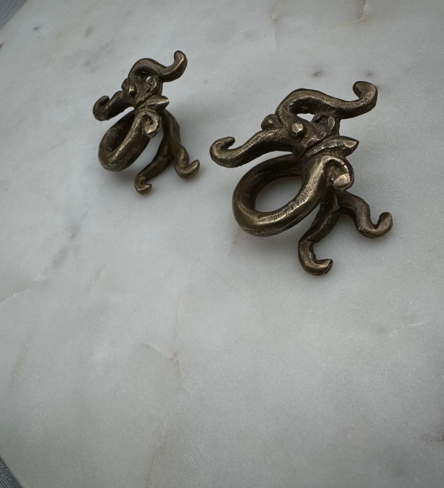 Dragon brass war weights from Borneo