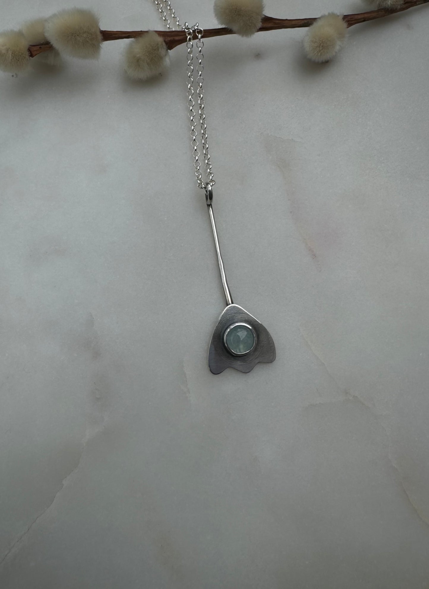 Aquamarine flower amulet