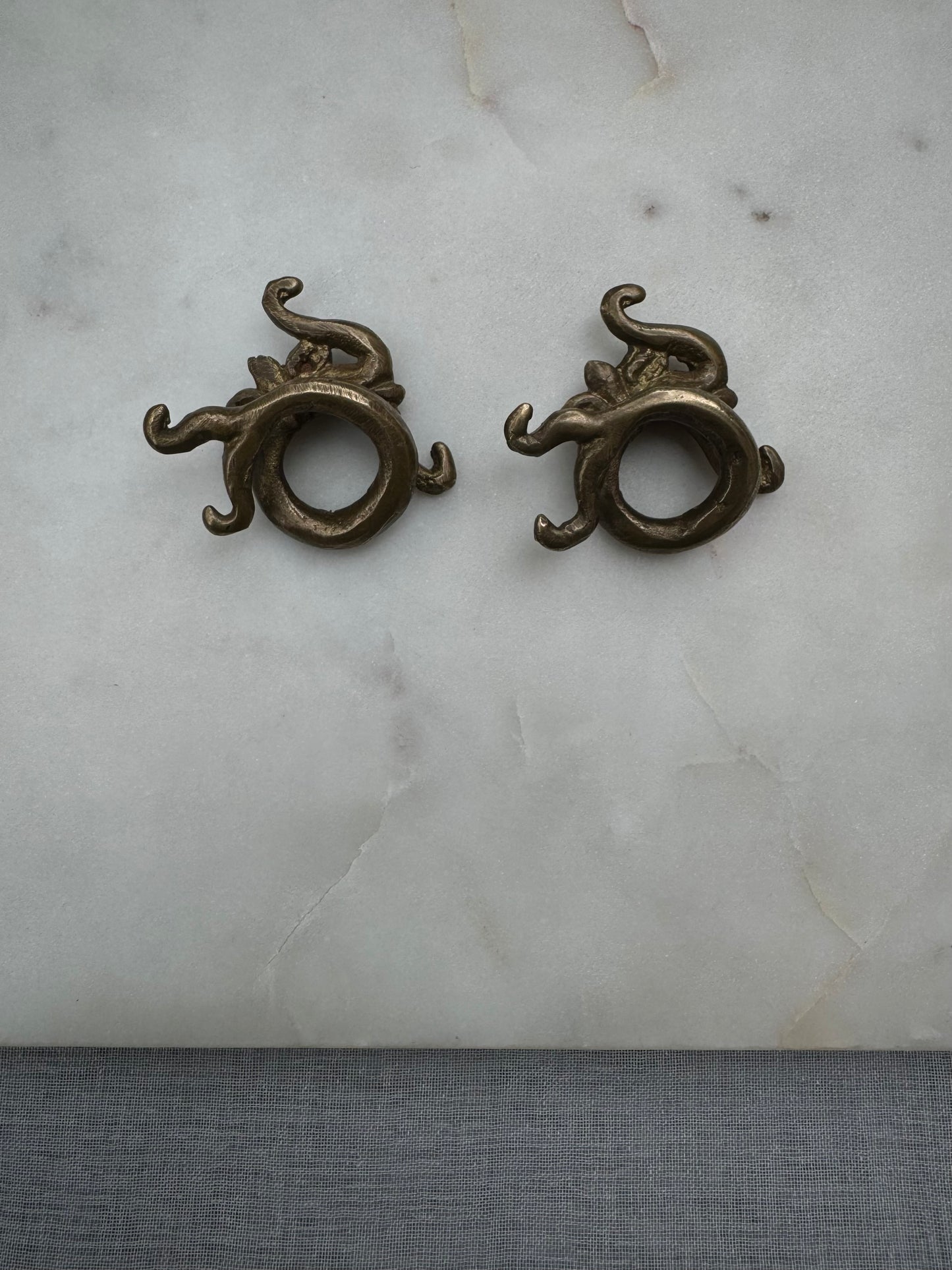 Dragon brass war weights from Borneo