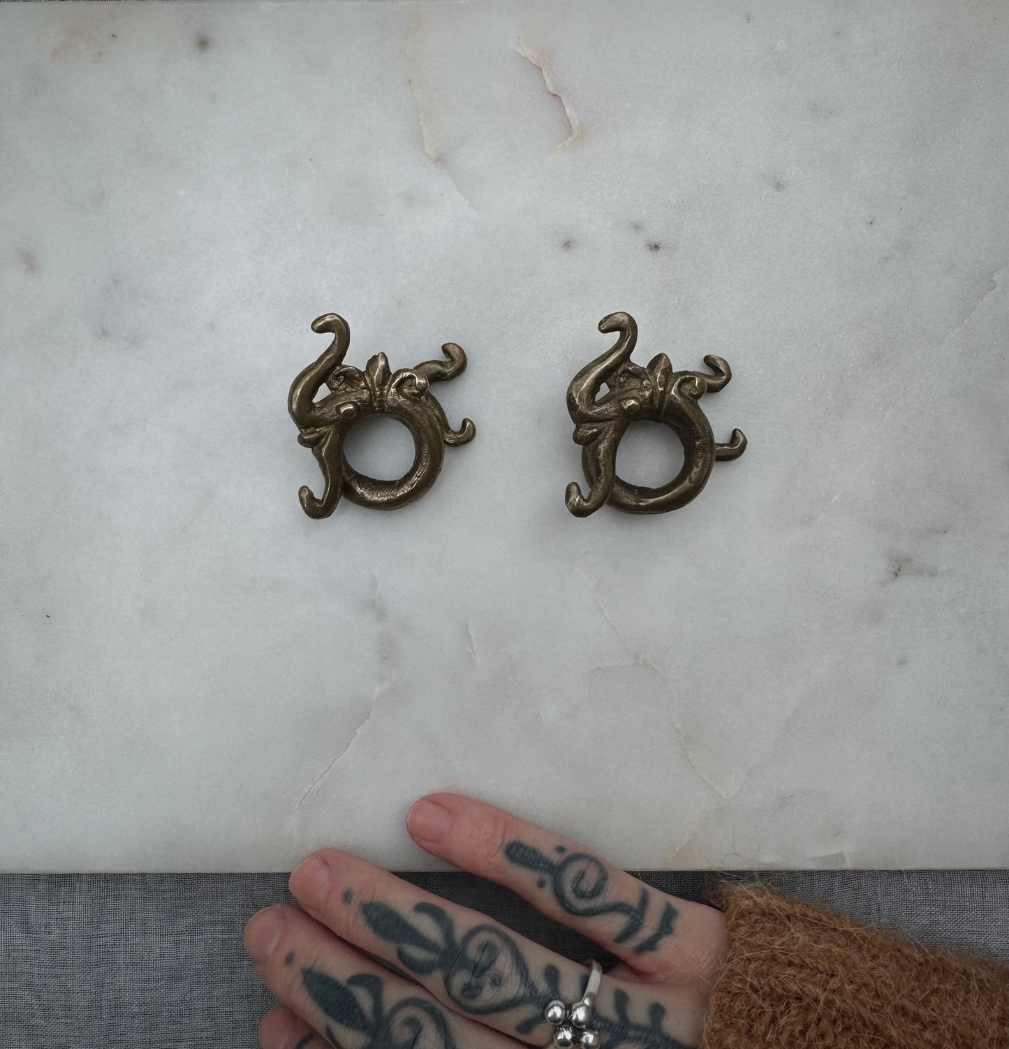 Dragon brass war weights from Borneo