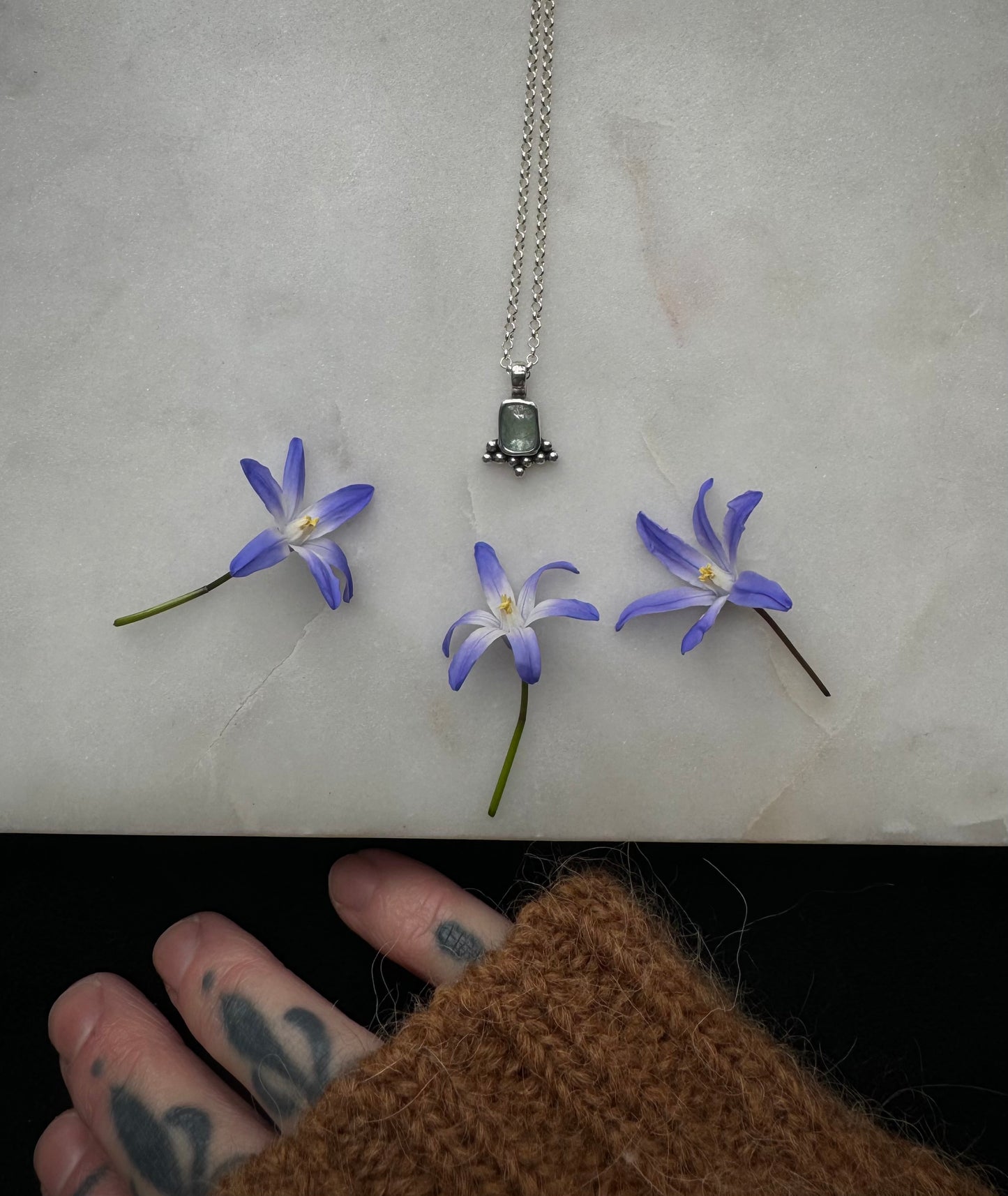 Small silver amulet with aquamarine